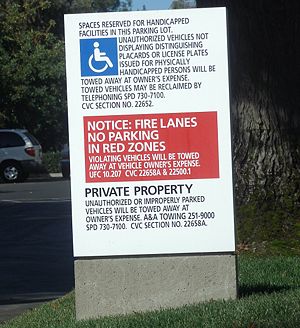 This sign declaring a parking lot to be "private property" illustrates one method of identifying and protecting property. Note the citations to legal statutes.