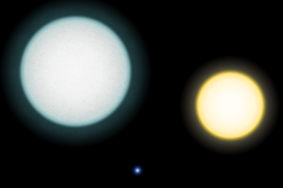 A comparison between the white dwarf IK Pegasi B (center), its A-class companion IK Pegasi A (left) and the Sun (right). This white dwarf has a surface temperature of 35,500&nbsp;K.