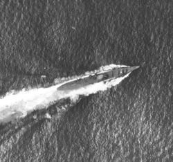 Japanese cruiser Chikuma under attack on October 26. The white spot in the center of the ship is where one of the 1,000-pound bombs hit directly on the bridge, causing heavy damage and high casualties.