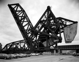 The B&OCT Bascule Bridge over the Chicago River, as seen from the northwest, circa 1988. This view shows the abandoned bridge in its locked upright position, with that of the St. Charles Air Line Railroad in the background.