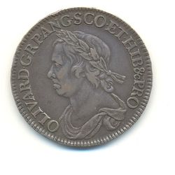 Half-Crown coin of Oliver Cromwell, 1658. The Latin inscription reads: OLIVAR.D.G.RP.ANG.SCO.ET.HIB&cPRO (OLIVARIUS DEI GRATIA REIPUBLICAE ANGLIAE SCOTIAE ET HIBERNIAE ET CETERORUM PROTECTOR), meaning "Oliver, by the Grace of God Protector of the Commonwealth of England, Scotland and Ireland and other (territories)".