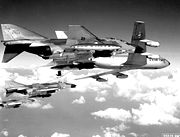 A flight of USAF F-4Cs refuel from a KC-135 tanker before making a strike against targets in North Vietnam. The Phantoms are fully loaded with 750-pound general purpose bombs, Sparrow missiles and external fuel tanks.