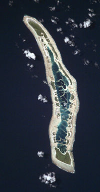 NASA orbital photo of Caroline Island; north is to the upper right. The two largest islets are Nake Islet (top) and South Islet (bottom) and are about 500 m wide.