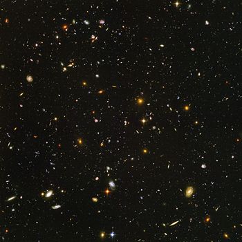 Hubble Ultra Deep Field image of a small region of the observable universe, near the constellation Fornax. The light from the smallest, most redshifted galaxies originated roughly 13 billion years ago.