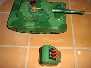 A toy tank with a remote control. Such toys are generally thought of a boys' toys, but some girls enjoy playing with them also.