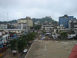 A street in Monrovia, Liberia - Old Ducor Hotel in the background.