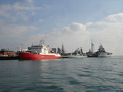 Four commissioned ships of the Royal Navy in Portsmouth dockyard; HMS Endurance, the Type 42 destroyer HMS Liverpool, the historic Ship of the line HMS Victory and the aircraft carrier HMS Ark Royal.