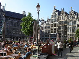 Grote Markt (main square): open air cafés, City Hall and guildhouses in background.