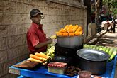 A roadside vendor selling roasted corn in India