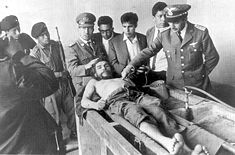 His corpse was displayed to the World press in the laundry house of the Vallegrande hospital. Side angle From above Face