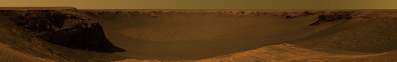 This approximate true-color image, taken by the Mars Exploration Rover Opportunity, shows the view of Victoria Crater from Cape Verde. It was captured over a three-week period, from October 16 – November 6, 2006.