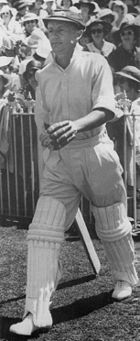 Bradman walking out to bat in the third Test against England at the Melbourne Cricket Ground in 1937. His 270 runs won the match for Australia and has been rated the greatest innings of all time.