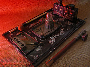 A complete opium smoking "layout" including a solid ivory opium pipe.