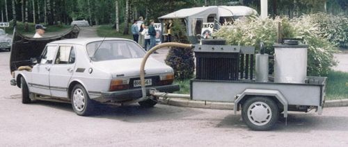 Saab 99 running on wood gas. Gas generator on trailer.
