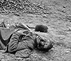 A dead soldier in Petersburg, Virginia 1865, photographed by Thomas C. Roche.
