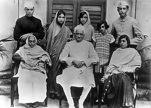The Nehru family - Motilal Nehru is seated in the center, and standing (L to R) are Jawaharlal Nehru, Vijayalakshmi Pandit, Krishna Hutheesing, Indira, and Ranjit Pandit; Seated: Swaroop Rani, Motilal Nehru and Kamala Nehru (circa 1927).