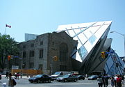 The Royal Ontario Museum. Note the contrast between the historic, brown stone part of the building and the newer, sharp-edged steel and glass addition.
