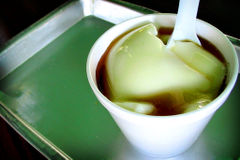 D&ograve;uhuā (豆花), is a soft tofu dish.  The fresh tofu is served warm and here dressed with sweet syrup.  Lamma Island, Hong Kong.